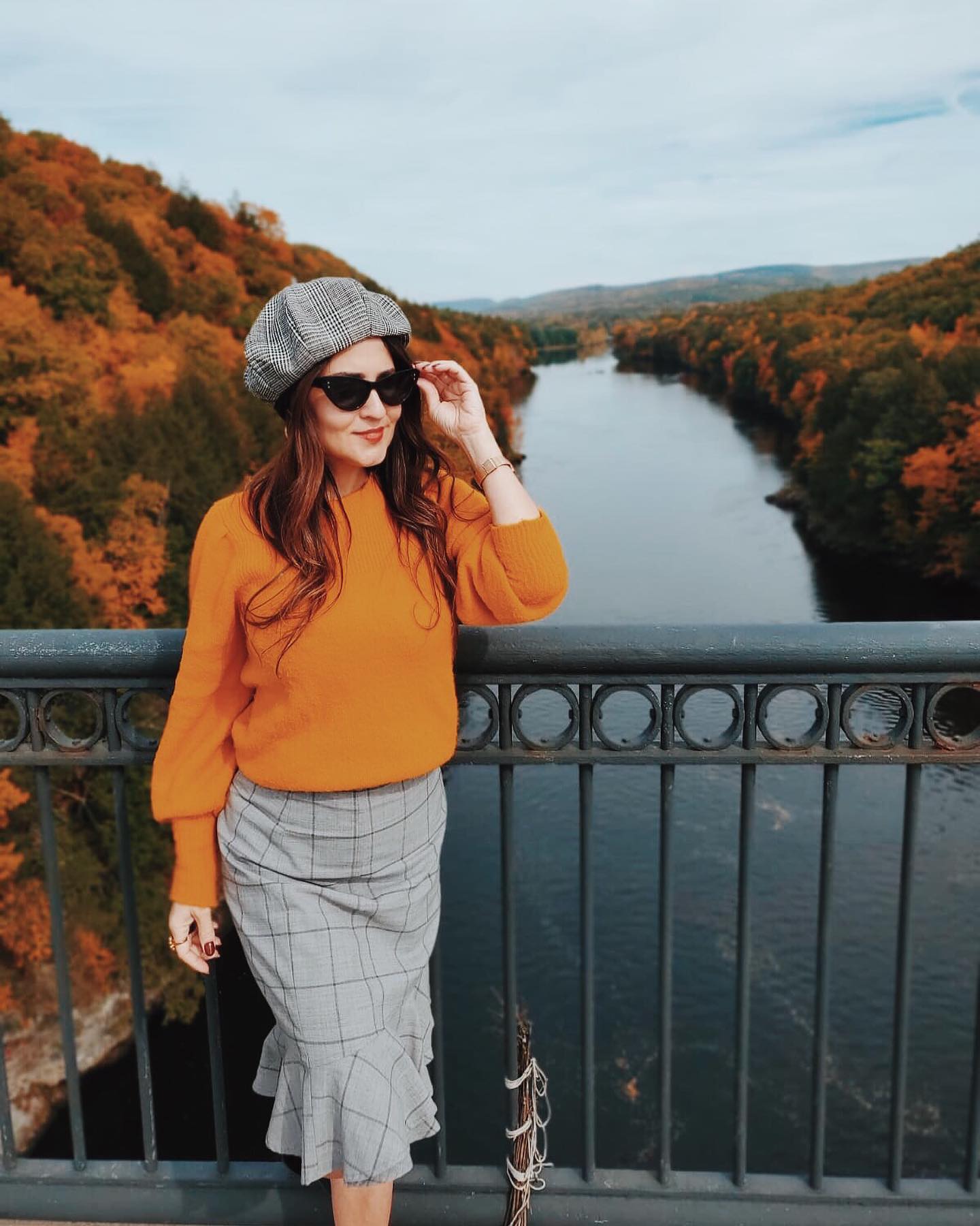 29 Chic Fall Skirt Outfits You Need for 2026 26 Cozy Orange Sweater With Plaid Midi Skirt