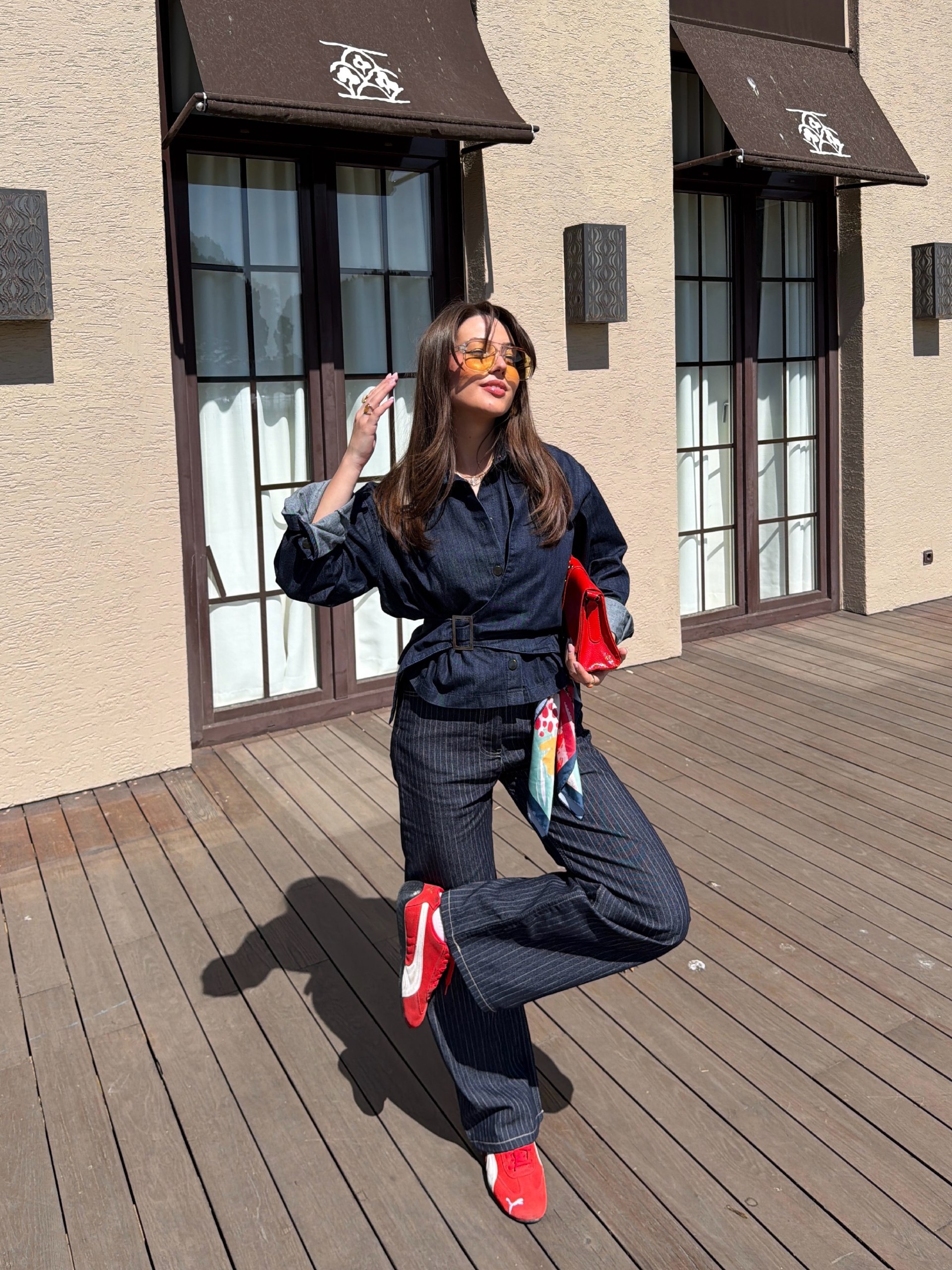 25 Denim on Denim Looks You Need for 2026 8 Dark Wash Denim Utility Jumpsuit With Red Accents