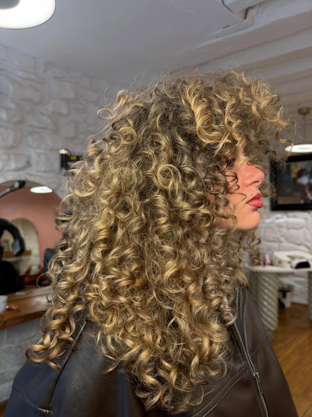 Defined Blonde Curls With Face-Framing Layers