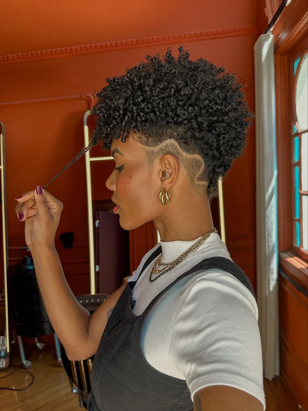 Defined Coily Pixie With Artistic Side Shave