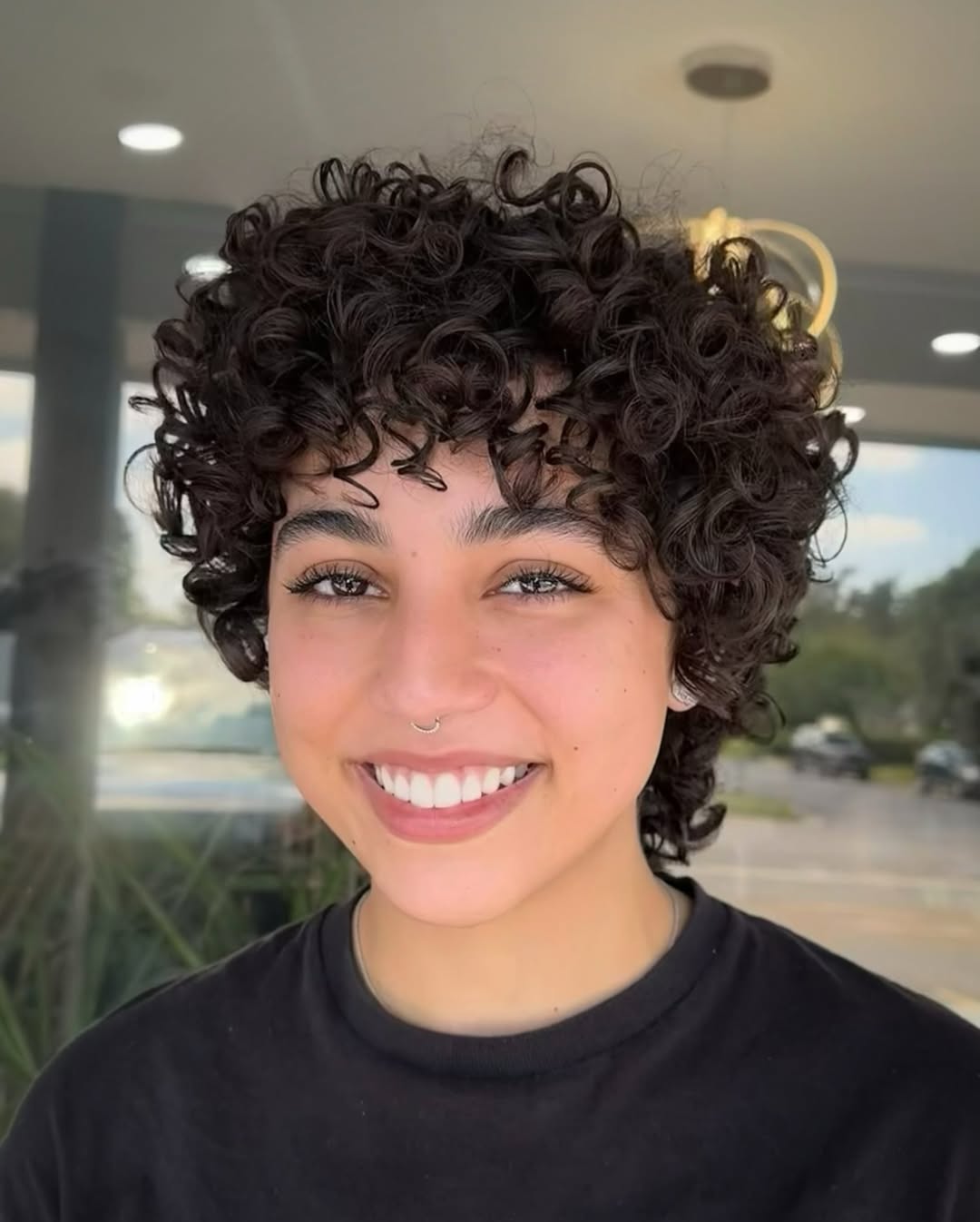 Defined Curly Pixie With Wispy Bangs