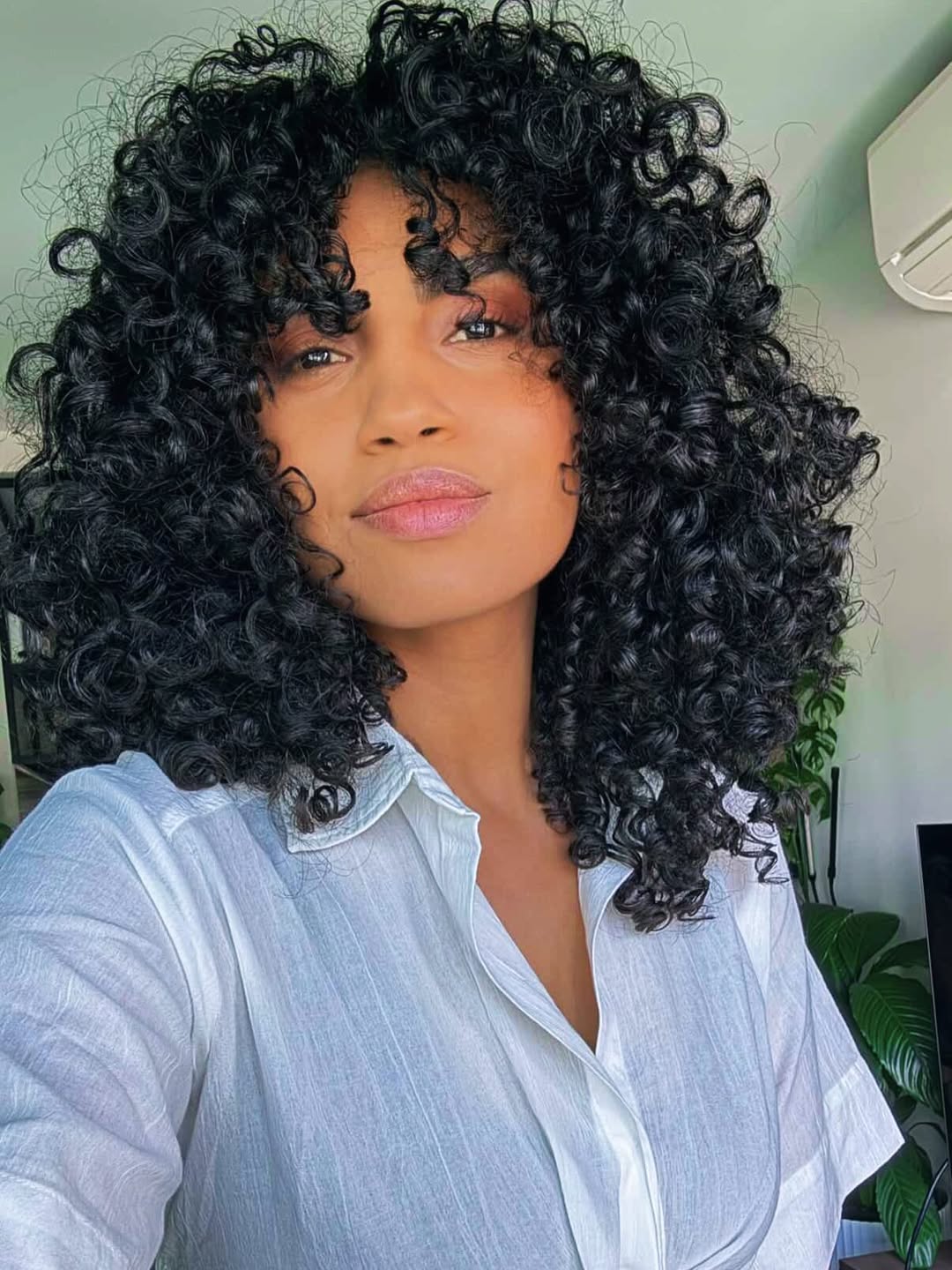 Defined Medium Curly Cut With Fringe