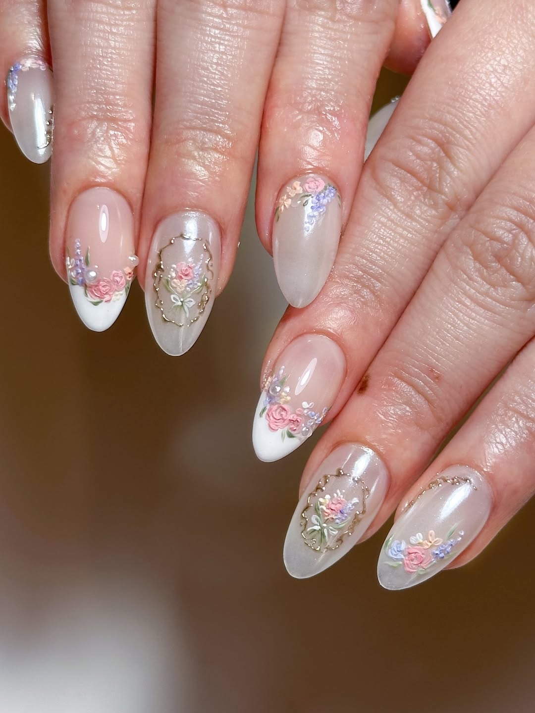 Delicate Floral And Frame Embellished Almond Nails