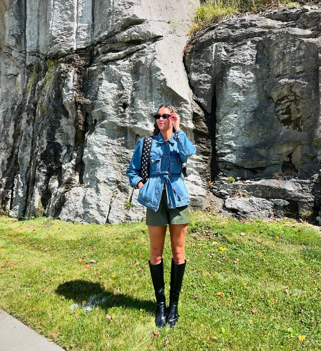 25 Early Fall Outfits You Need for 2026 19 Denim Belted Jacket With Olive Shorts and Boots