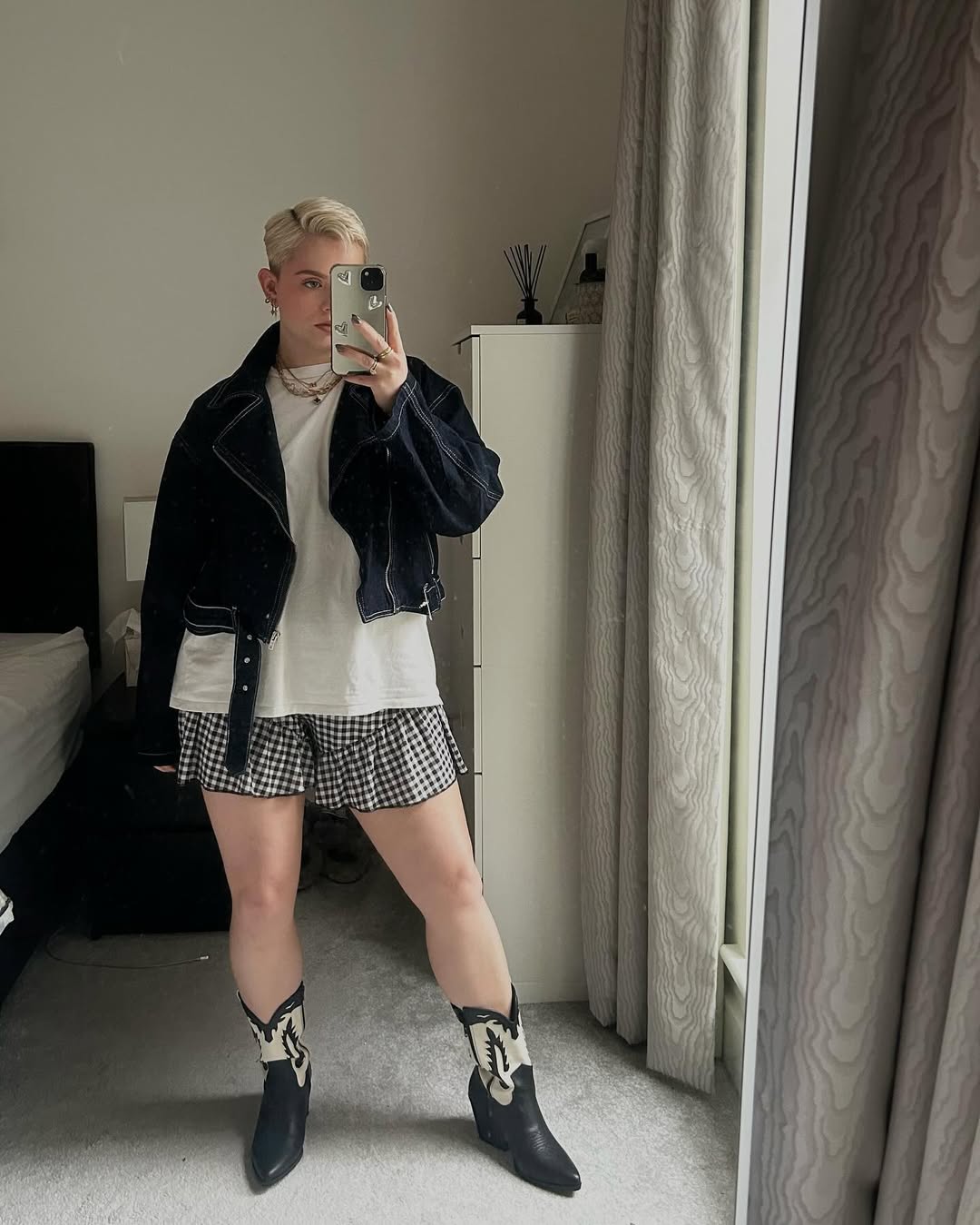 25 Cowboy Boot Outfits You Need for 2026 14 Denim Jacket With Gingham Shorts And Cowboy Boots