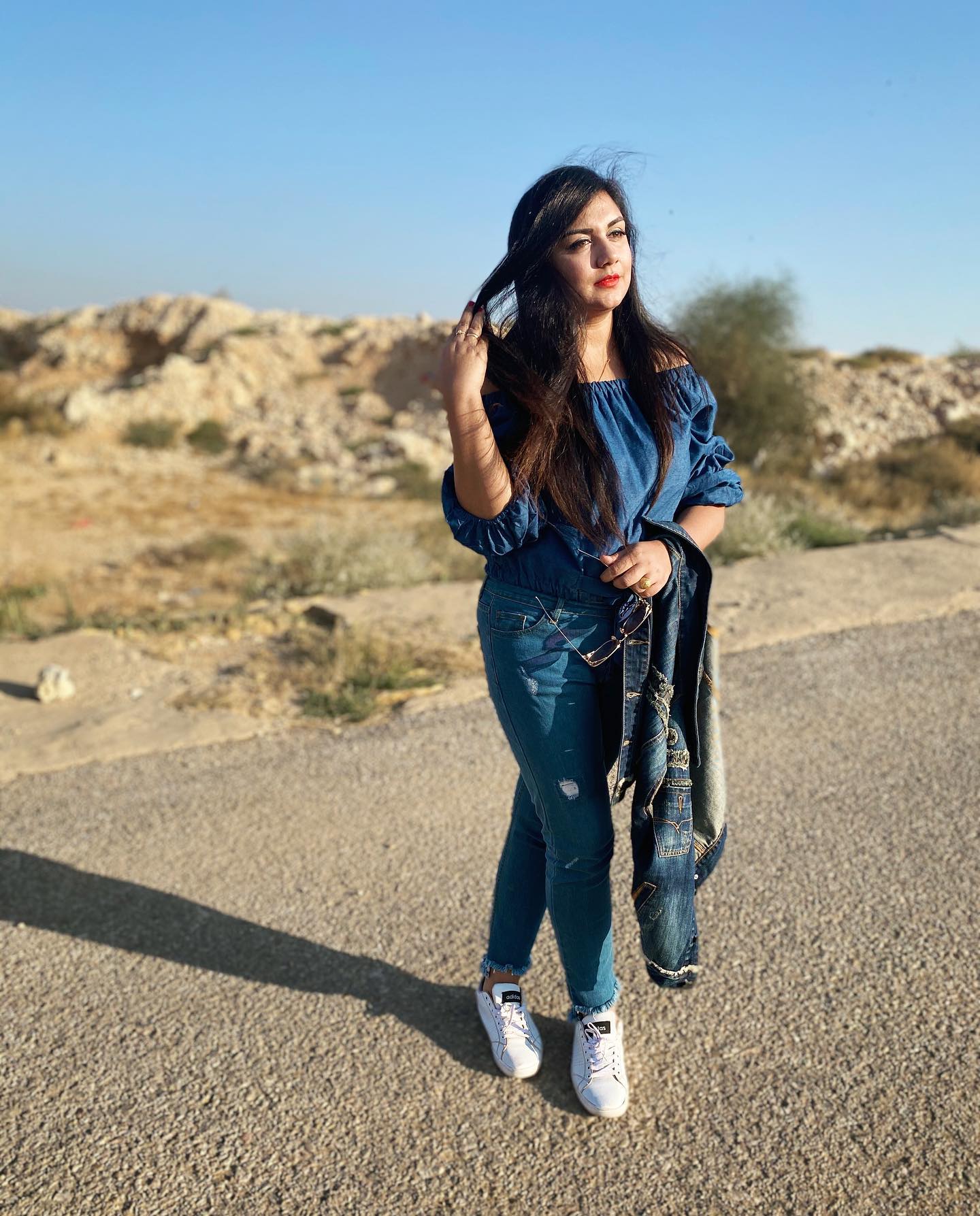25 Denim on Denim Looks You Need for 2026 14 Denim Off-the-Shoulder Top With Distressed Jeans