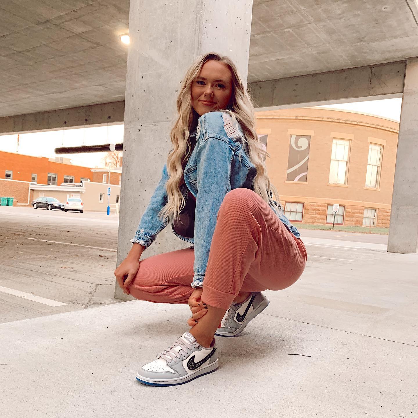 27 Jean Jacket Outfits You Need for 2026 10 Distressed Denim Jacket With Pink Lounge Pants