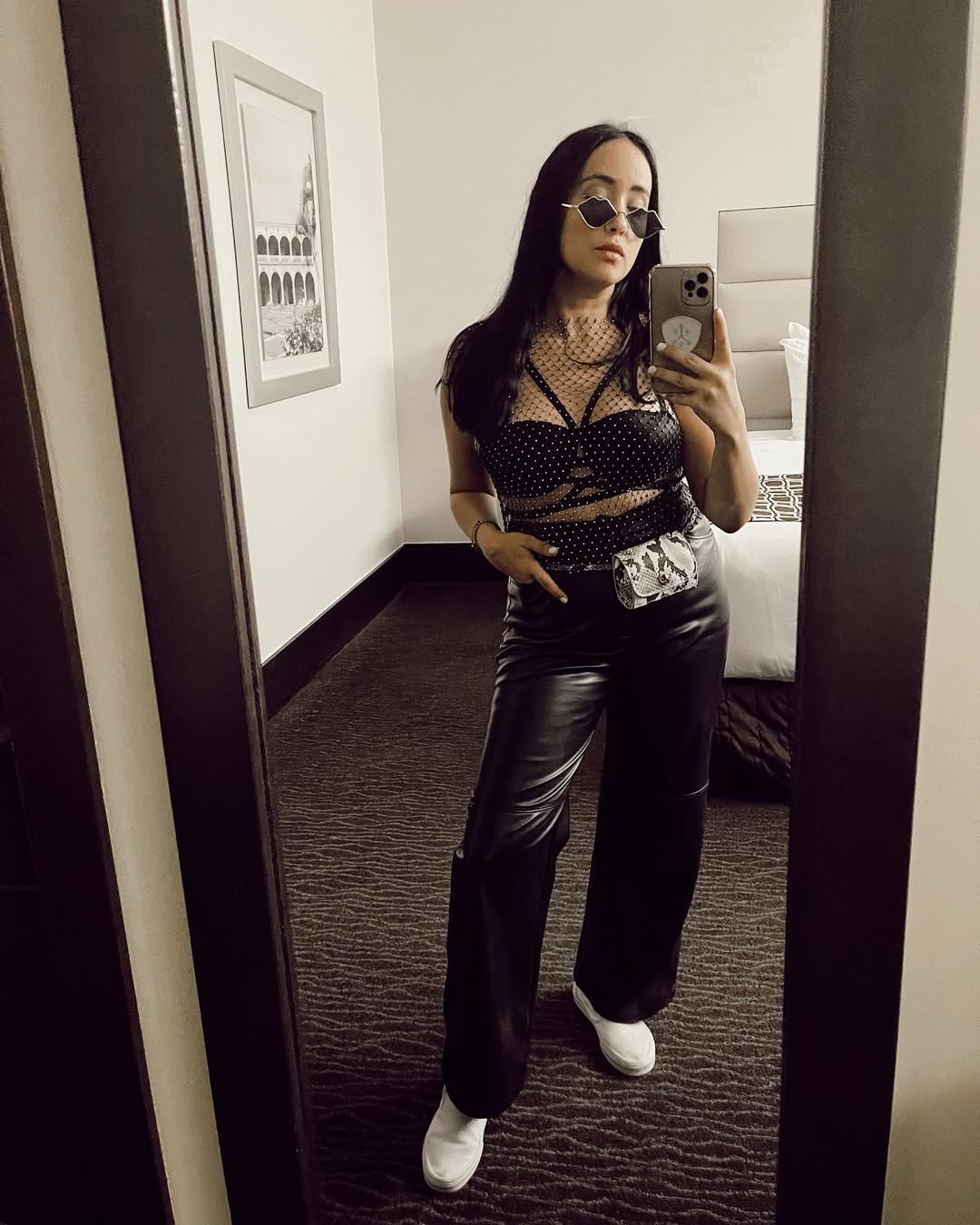 25 Concert Outfit Ideas You Need for 2026 24 Edgy Rhinestone Mesh Top And Faux Leather Pants