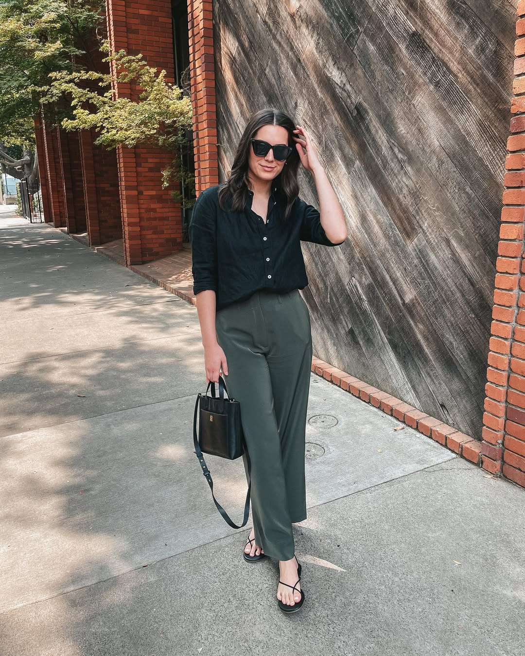 25 Early Fall Outfits You Need for 2026 12 Effortless Black Button-Down and Olive Wide-Leg Trousers