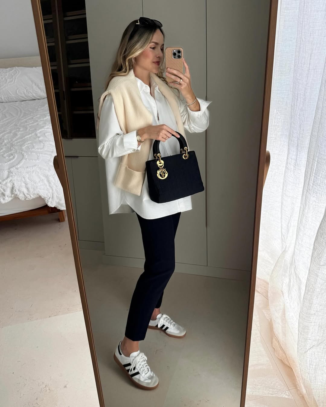 Effortless Cream Vest Over White Shirt and Navy Trousers