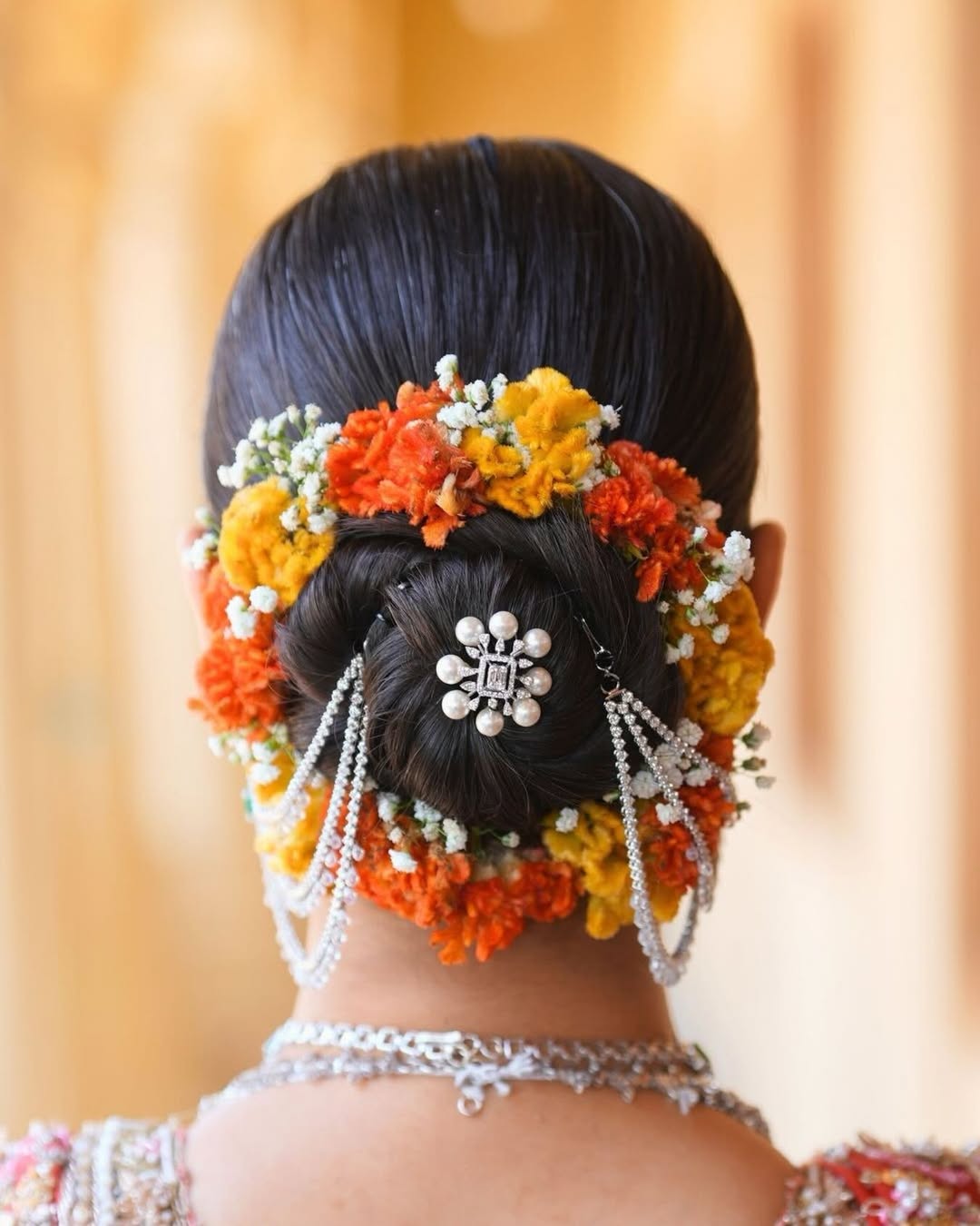 Elegant Bridal Bun With Jewel And Flower Details