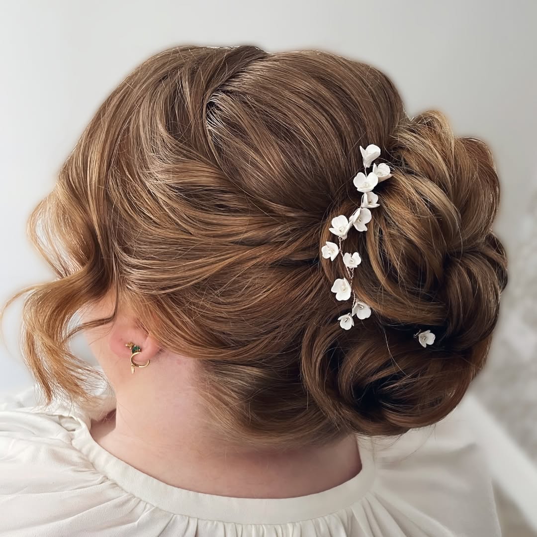 Elegant Bridal Updo with Delicate Flower Picks