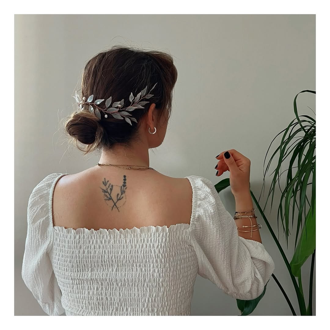 Elegant Bridal Updo with Delicate Leaf Hairpin