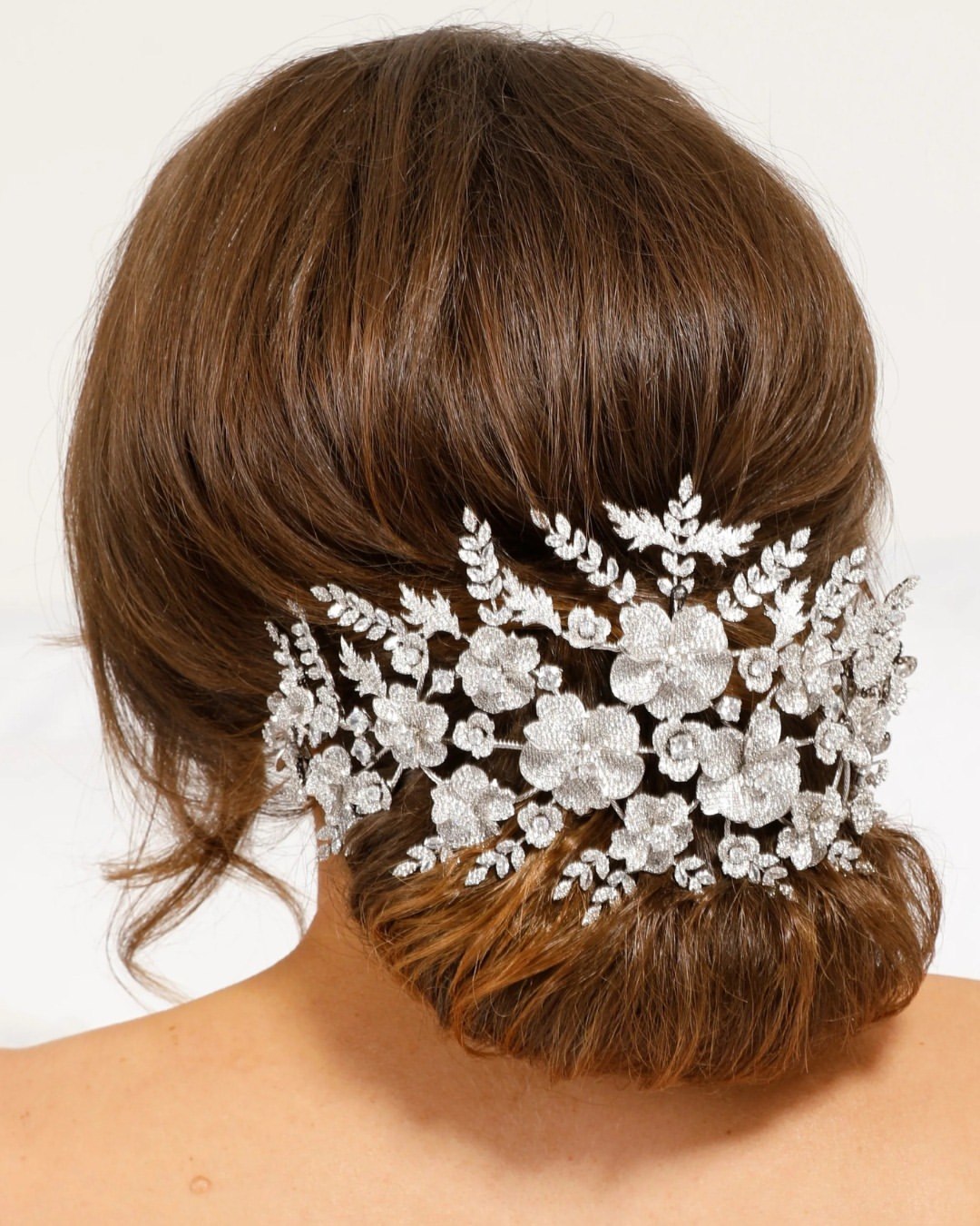 Elegant Bridal Updo with Floral Embellished Accessory