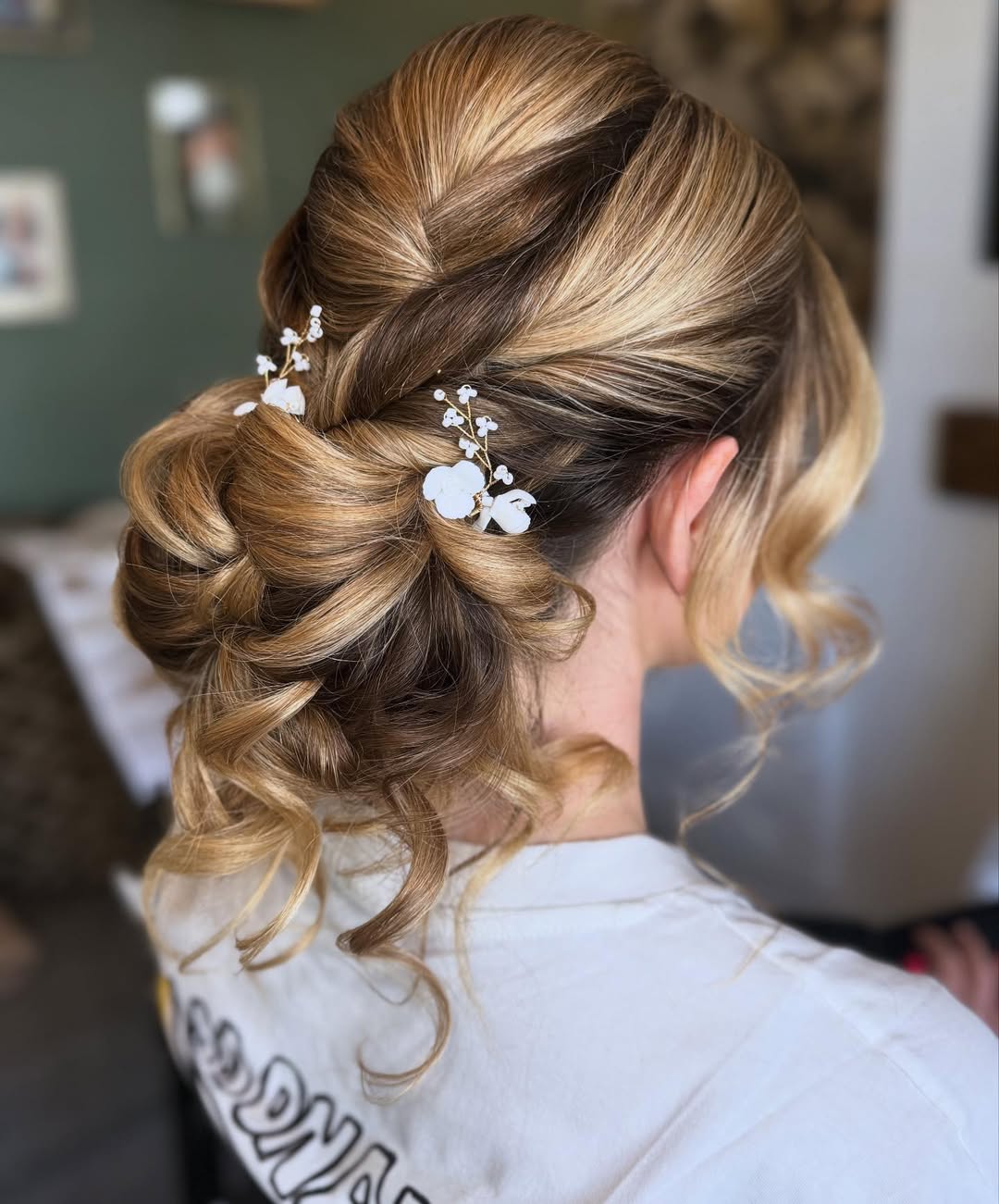 Elegant Bridal Updo With Floral Hair Pins