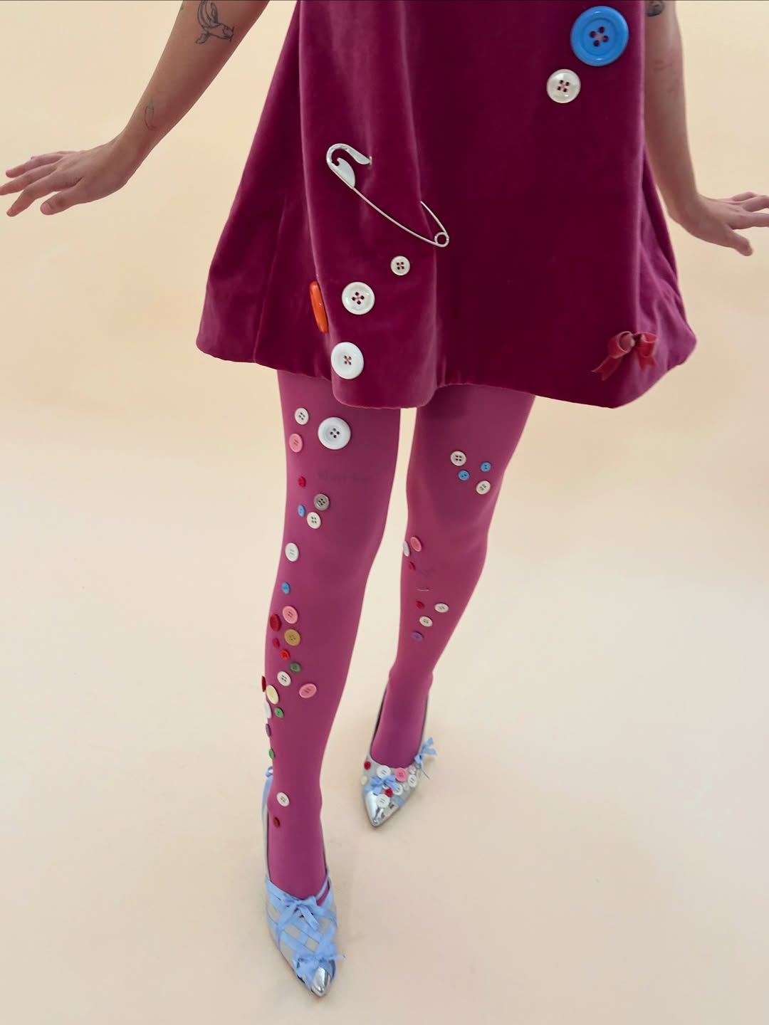 25 Dress with Tights Trends You Must See for 2026 19 Embellished Button Dress With Vibrant Tights