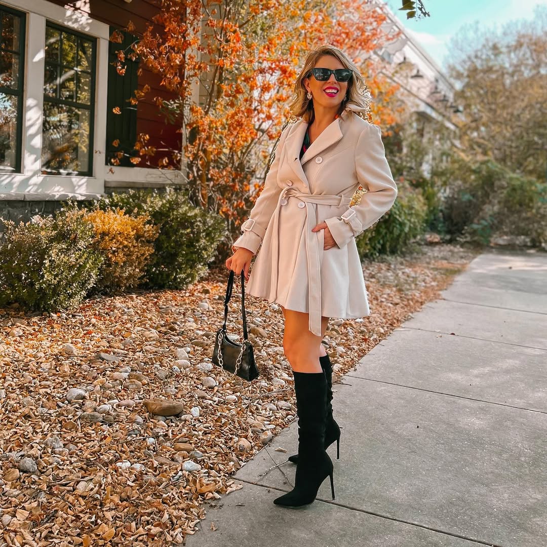 30 Chic Fall Outfits Women Will Love in 2026 32 Flared Trench Coat With Knee High Boots