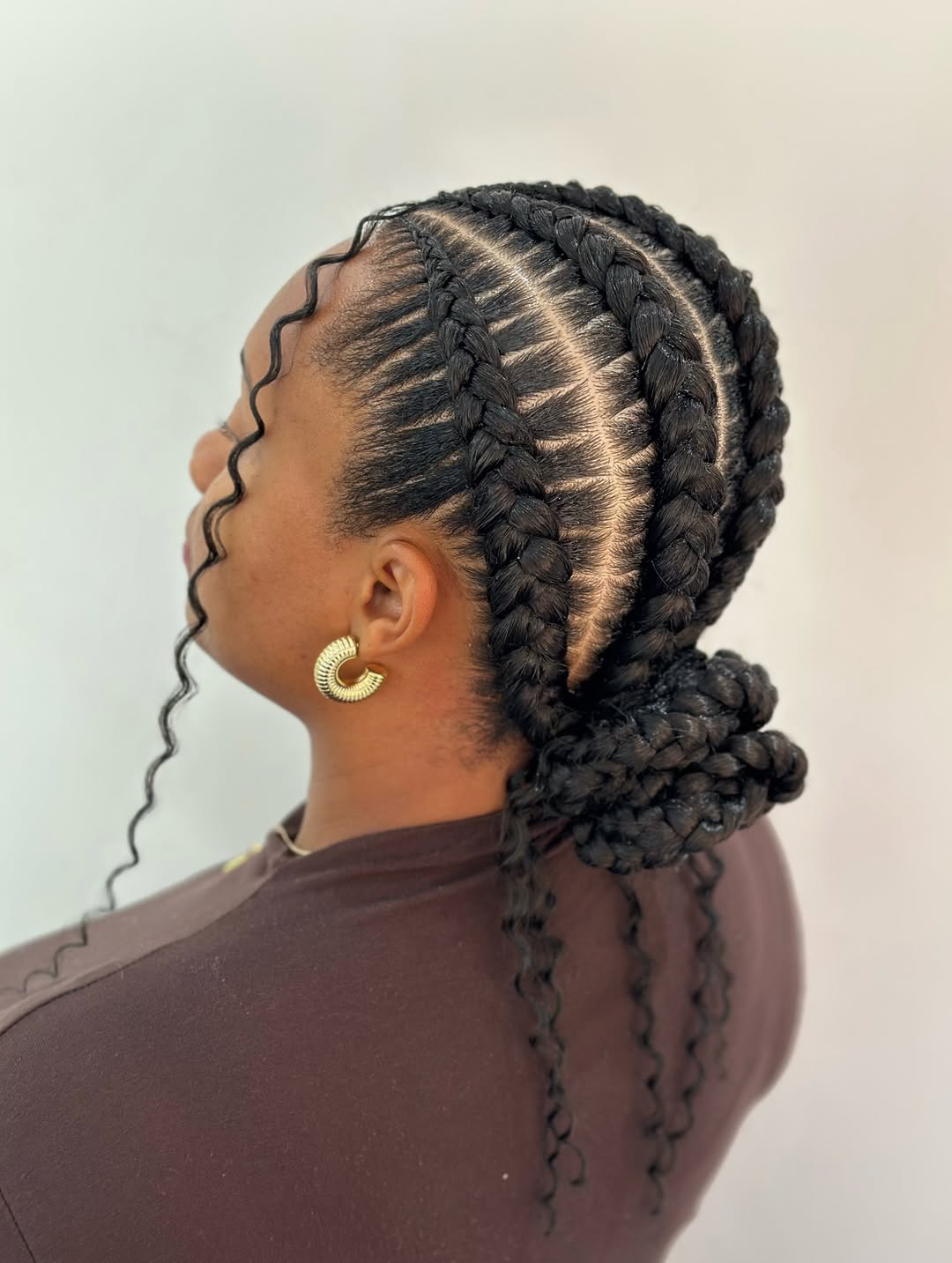 Ghana Braids Updo With Curly Wisps And Edges