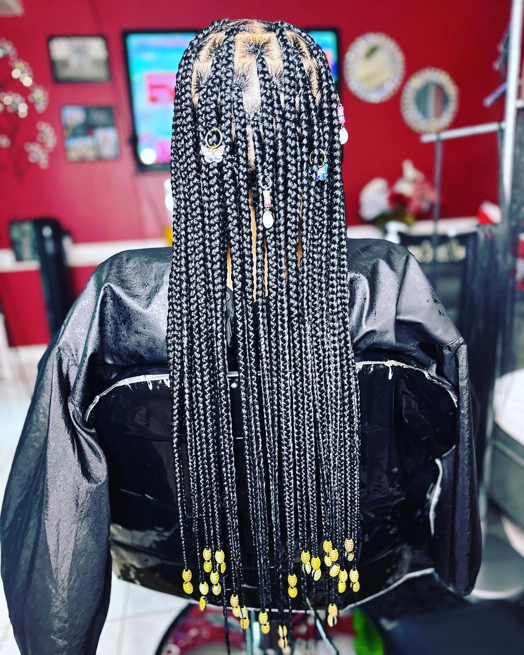 Glamourous Box Braids with Gold Embellishments