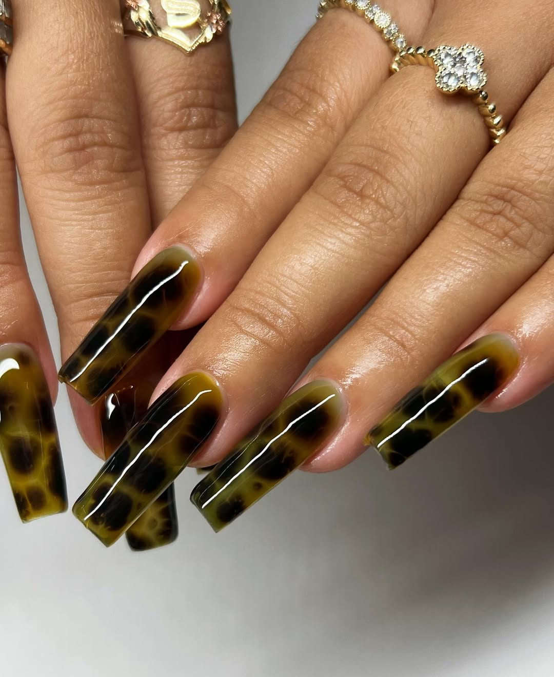 27 Tortoise Nail Trends You Need for 2026 12 Glossy Dark Tortoiseshell Extra-Long Square Nails