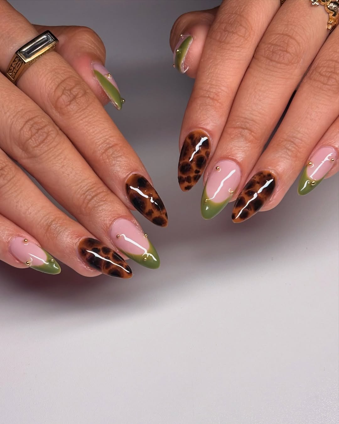 27 Tortoise Nail Trends You Need for 2026 25 Glossy Tortoise And Olive Green French Almond Manicure