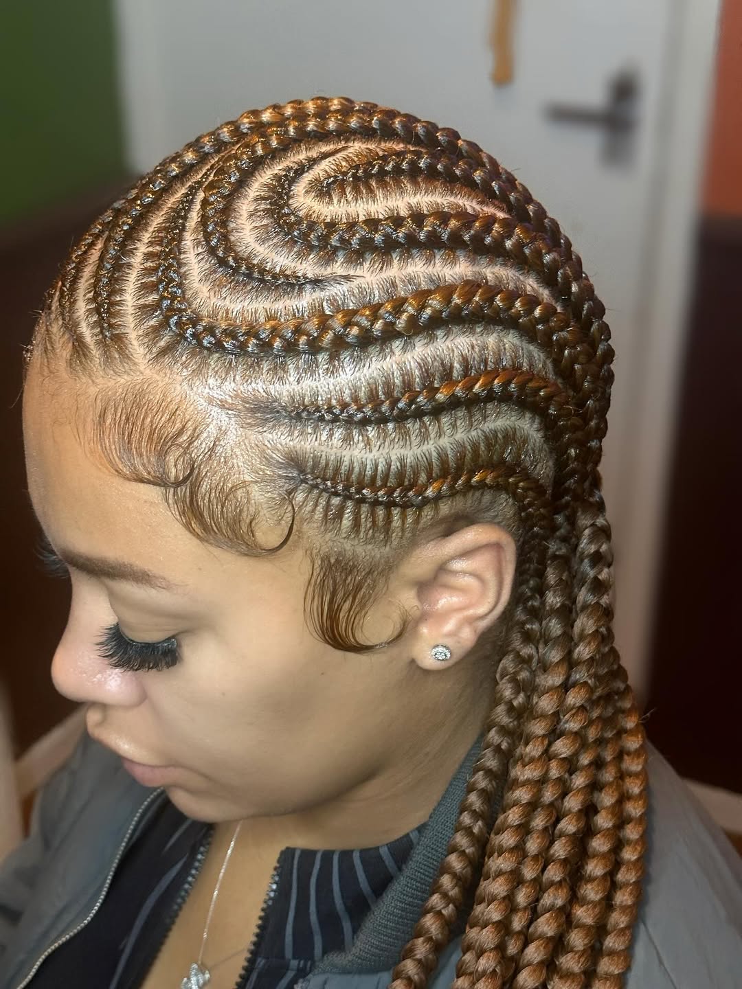 Golden Brown Swirl Cornrows With Laid Edges