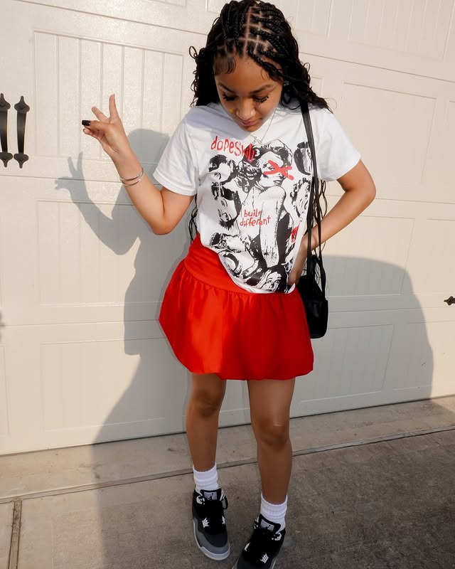 25 Epic School Outfit Ideas for 2026 You Need Now 26 Graphic Tee And Red Skirt Street Style School Outfit