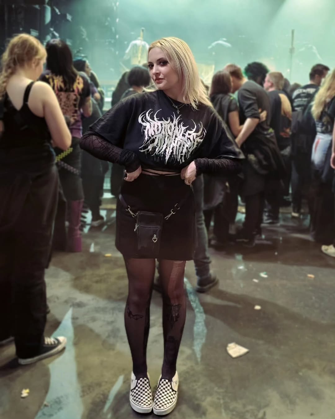 25 Concert Outfit Ideas You Need for 2026 15 Graphic Tee Band Merch And Mini Skirt Concert Look