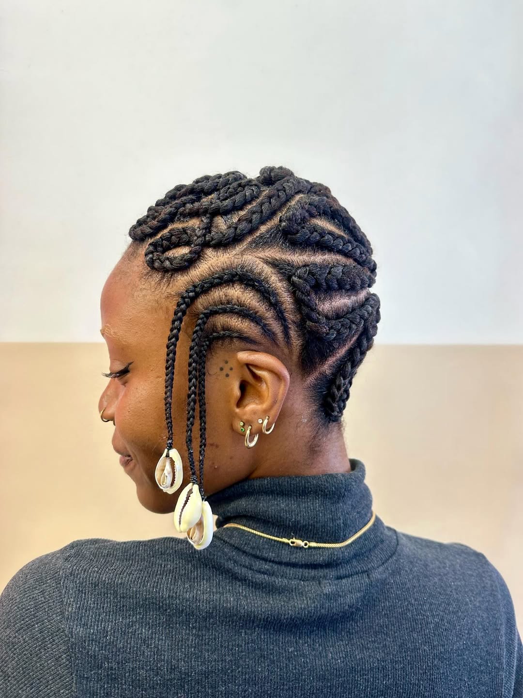 Intricate Cornrow Braids With Cowrie Shell Accents