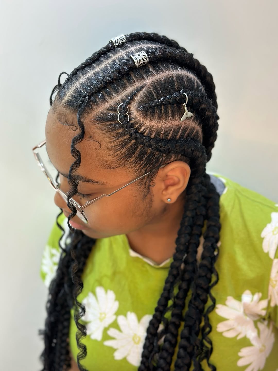 Intricate Cornrows with Accessorized Passion Twist Braids