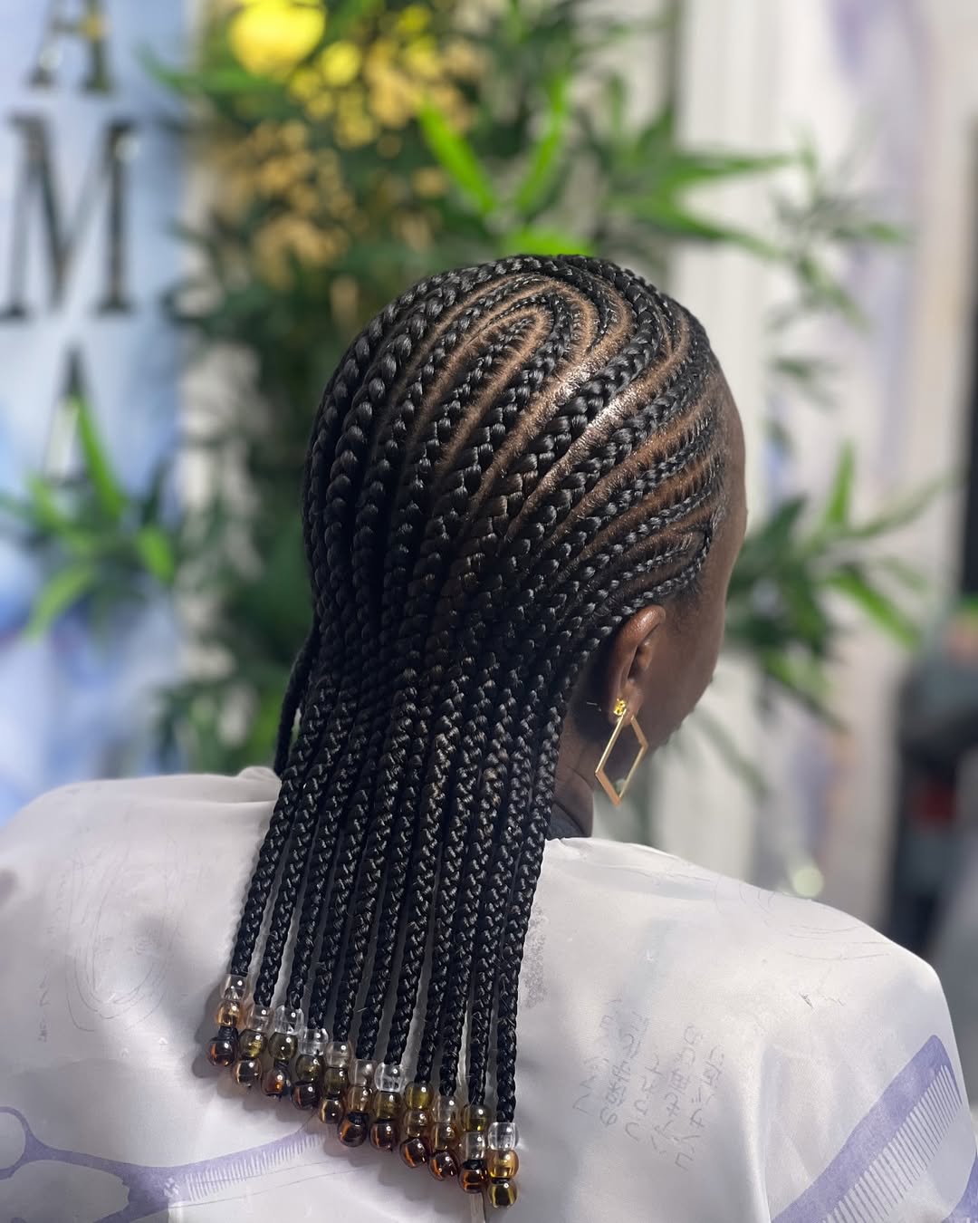 Intricate Cornrows With Beaded Ends And Swirls