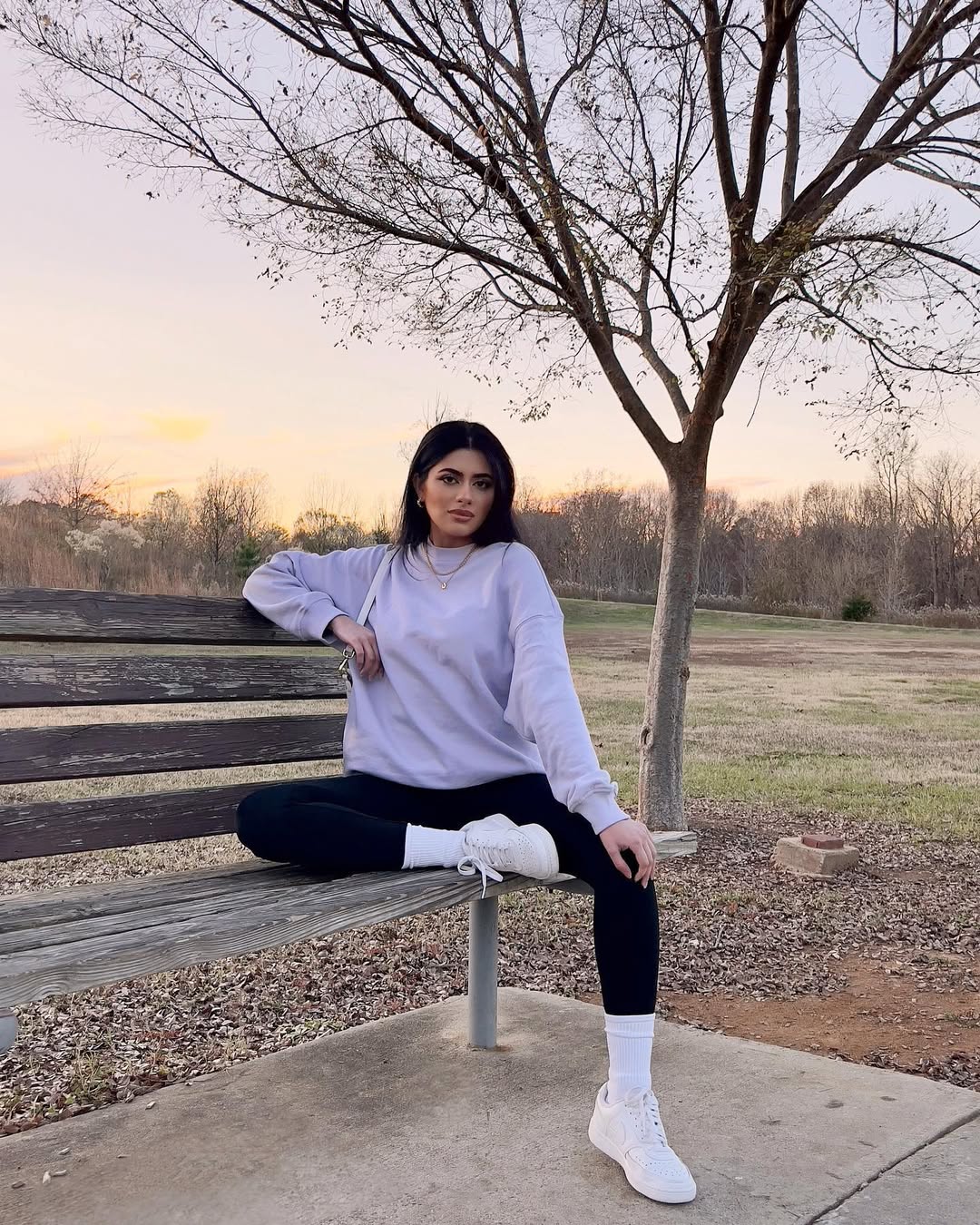 25 Fall Transition Outfits You Need for 2026 7 Lavender Sweatshirt And Black Leggings Athleisure Look