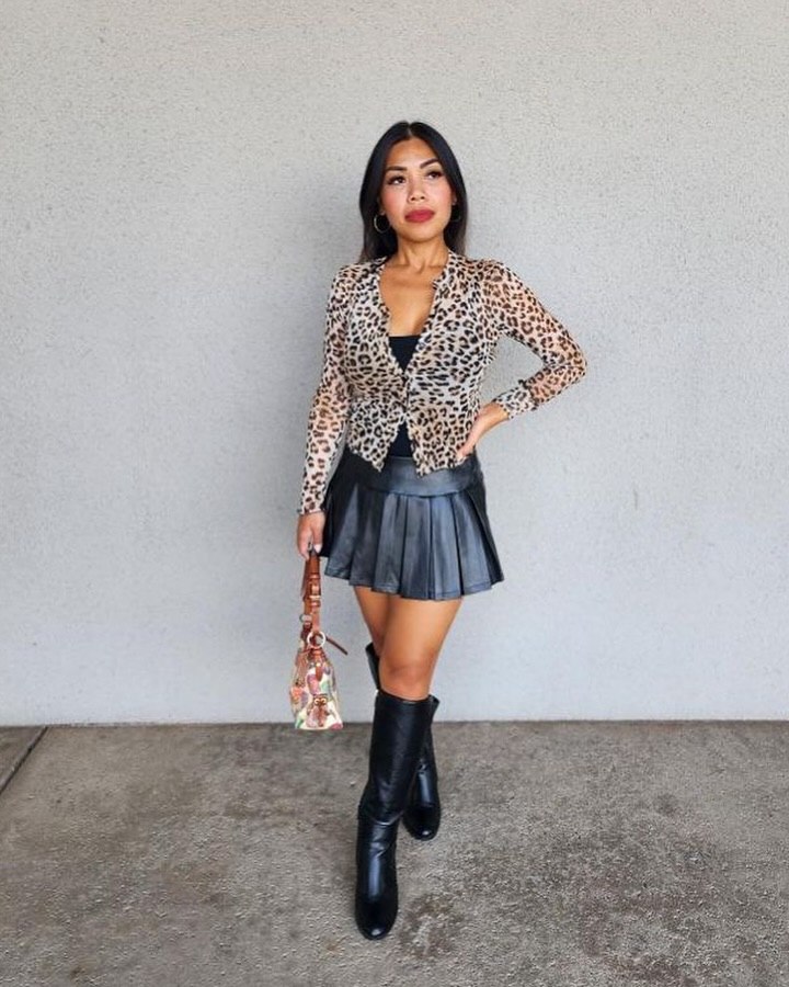27 Fall Boot Outfit Ideas You Need Now 9 Leopard Mesh Top and Black Leather Pleated Skirt Boots
