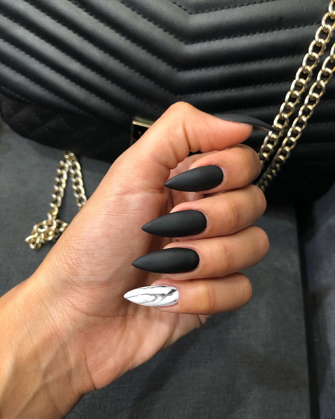 Matte Black Stiletto Accented With Marble Art Nail