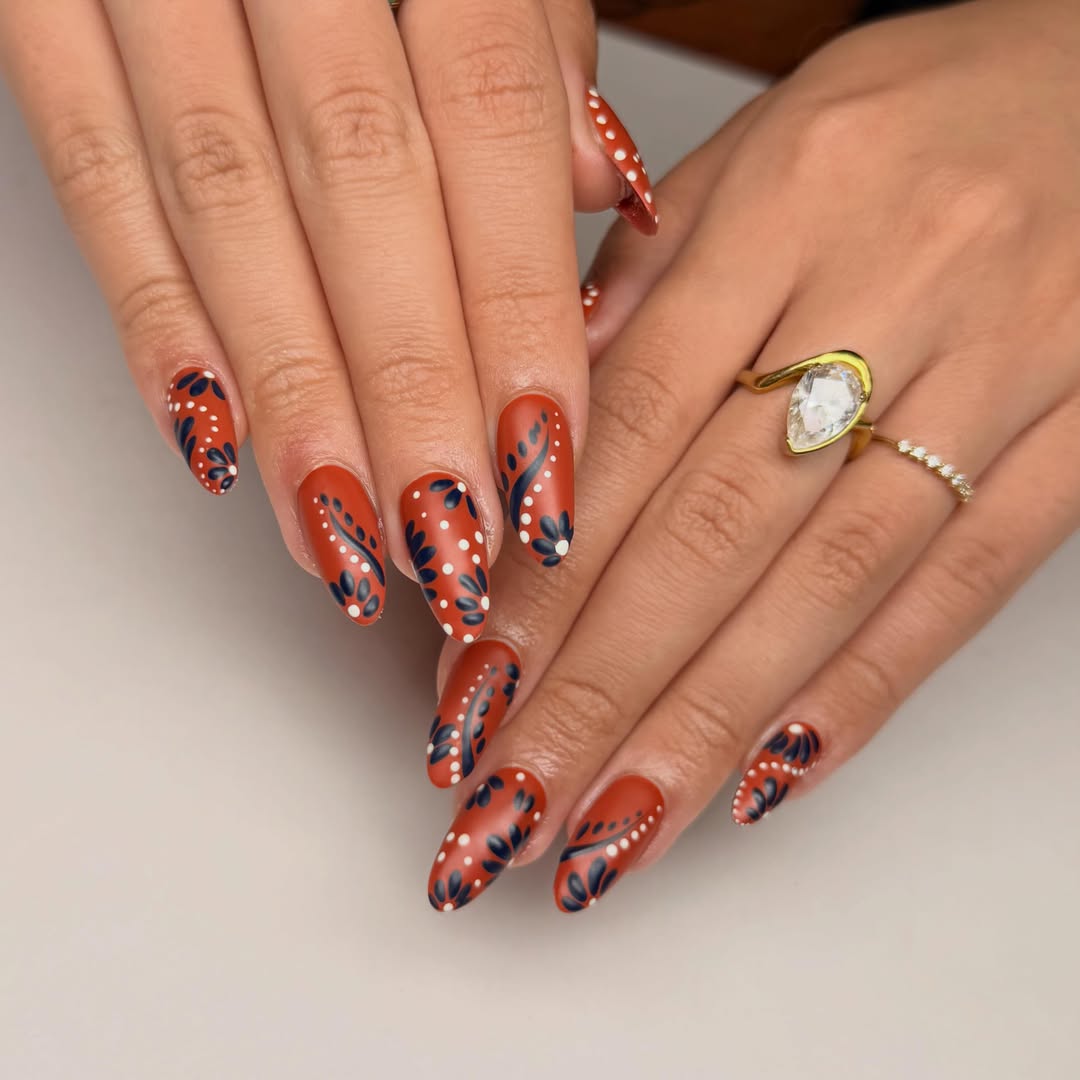 27 Stunning Mexican Nail Designs for 2026 28 Matte Rust With Folk Art Floral Design