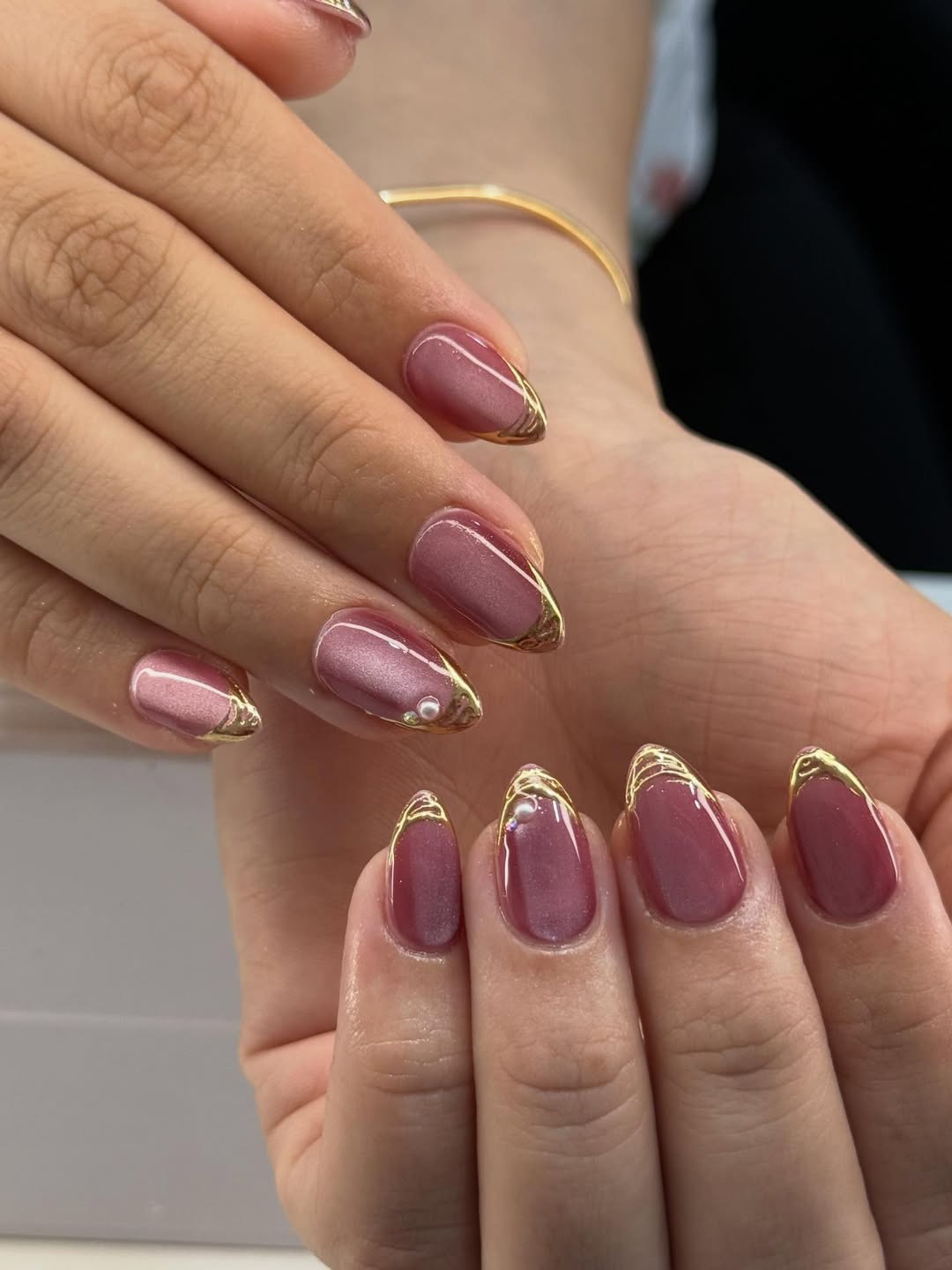 Mauve Shimmer Gold Trim Pearl Embellished Almond Nails