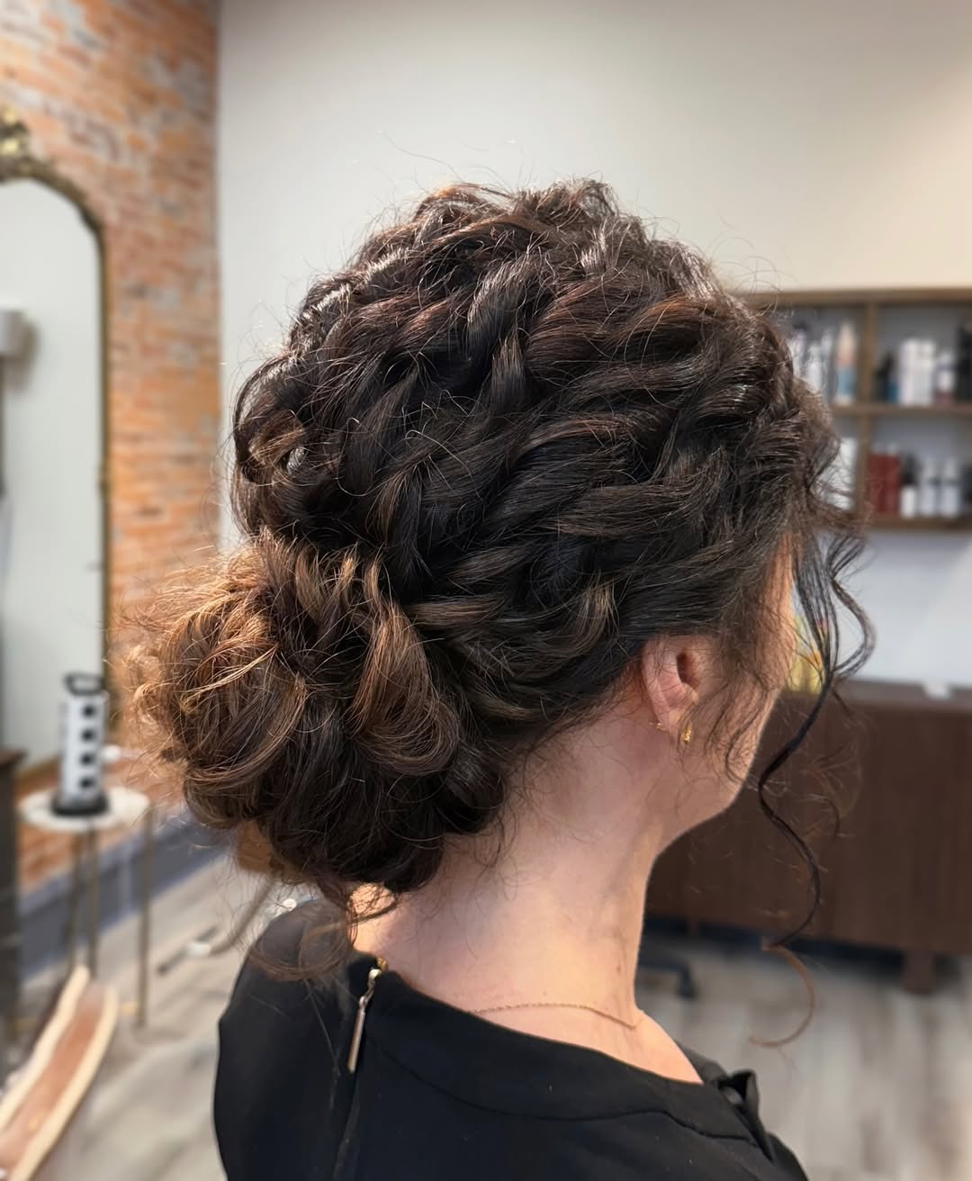 Messy Curly Updo With Face-Framing Tendrils