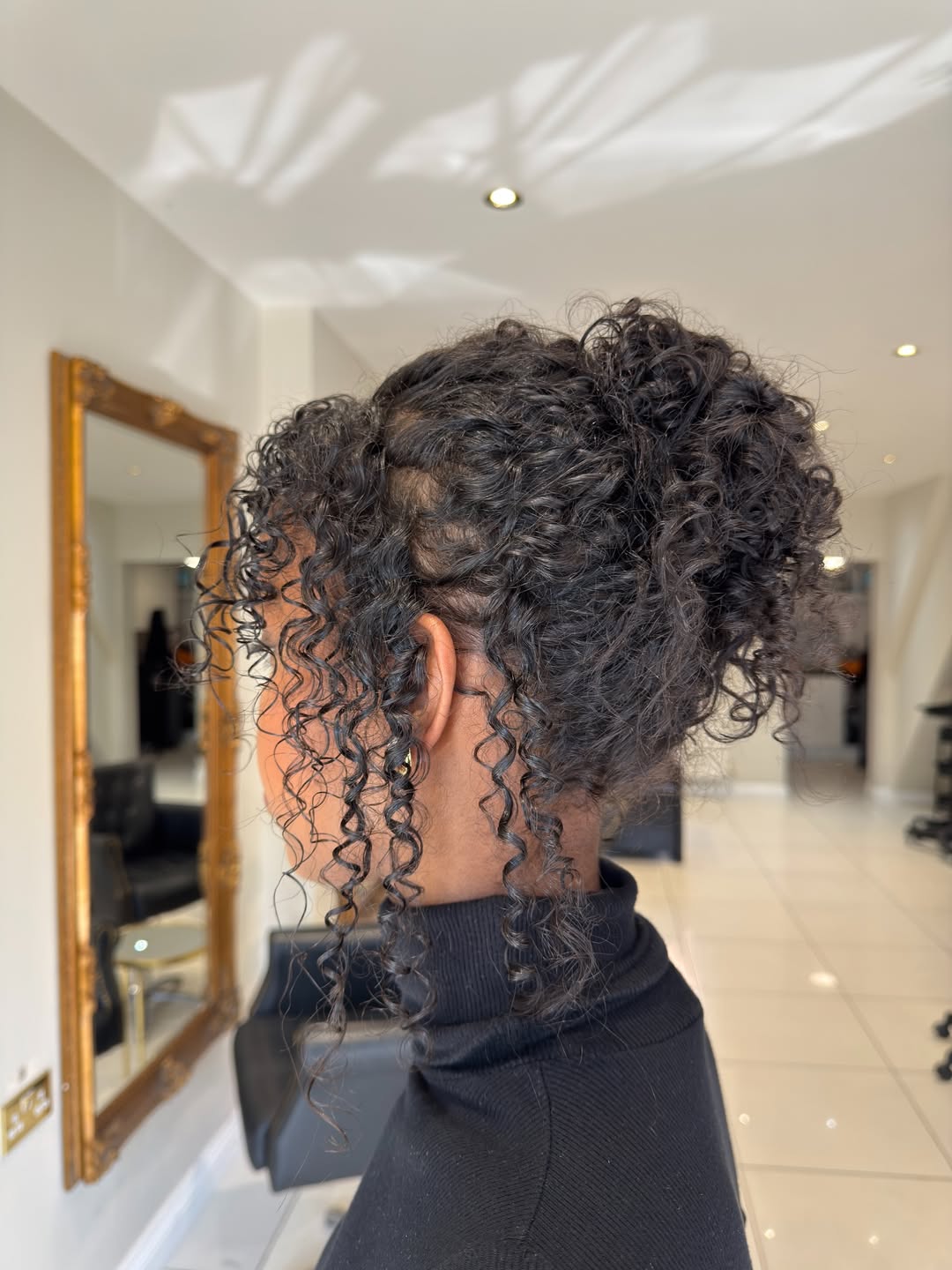 Messy Updo With Face-Framing Curls