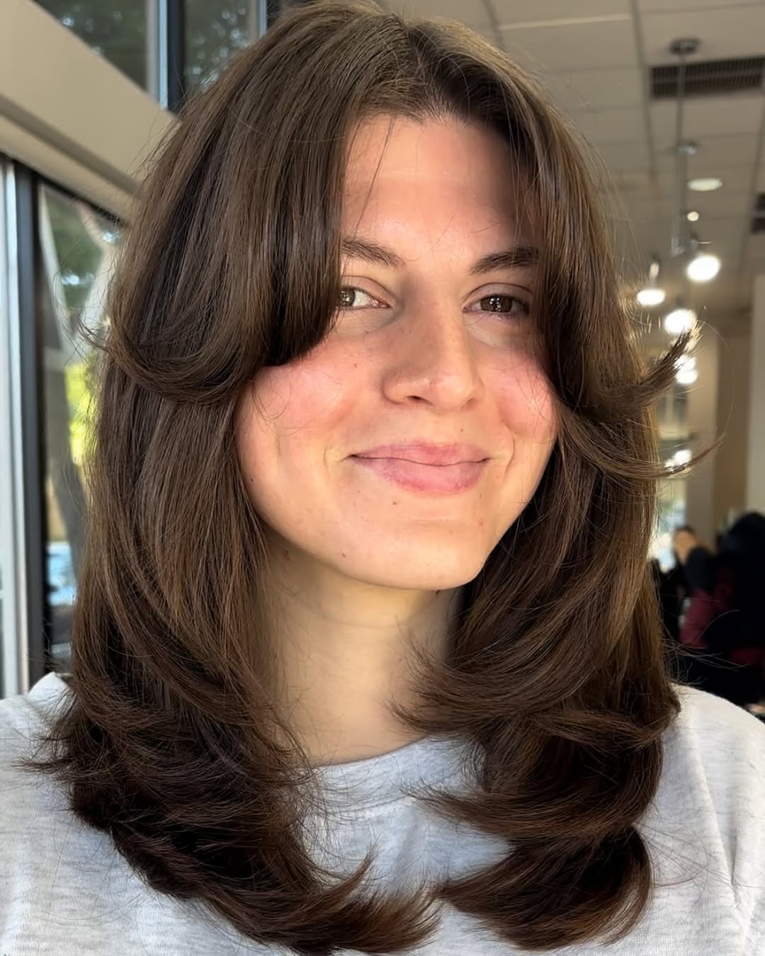 Mid Length Chocolate Brown Layers With Curtain Bangs