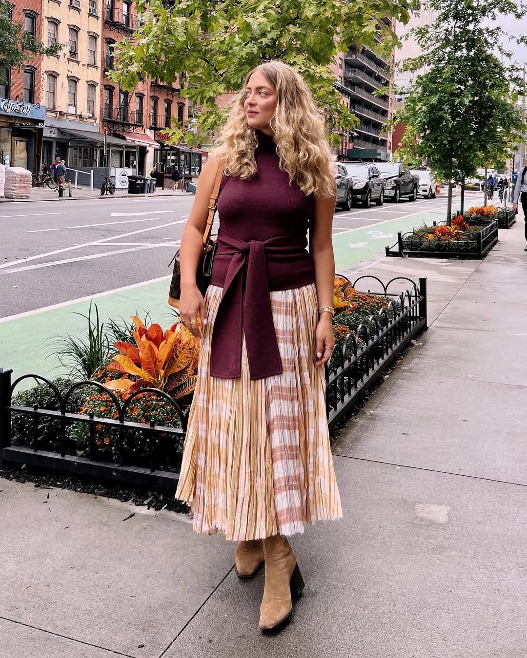 25 Early Fall Outfits You Need for 2026 15 Monochrome Knit Top With Plaid Pleated Midi Skirt