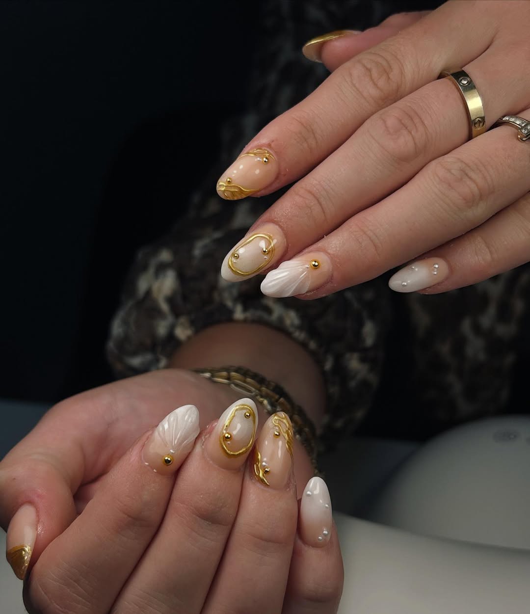 Opulent Gold Embellished Milky Ombre Almond Nails