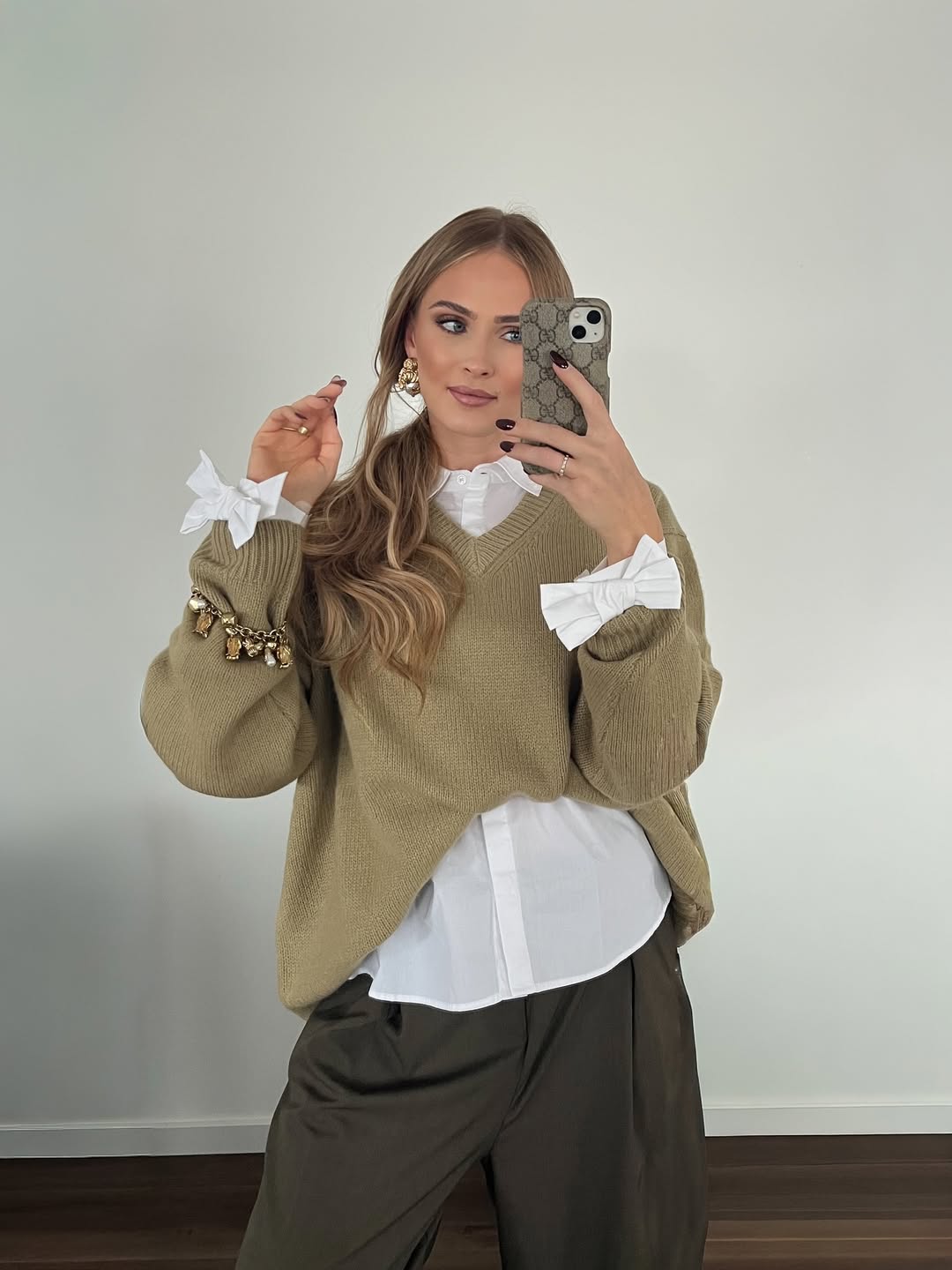 29 Work Outfits You Need for 2026 Trends 29 Oversized Knit Sweater Over Crisp White Shirt Outfit