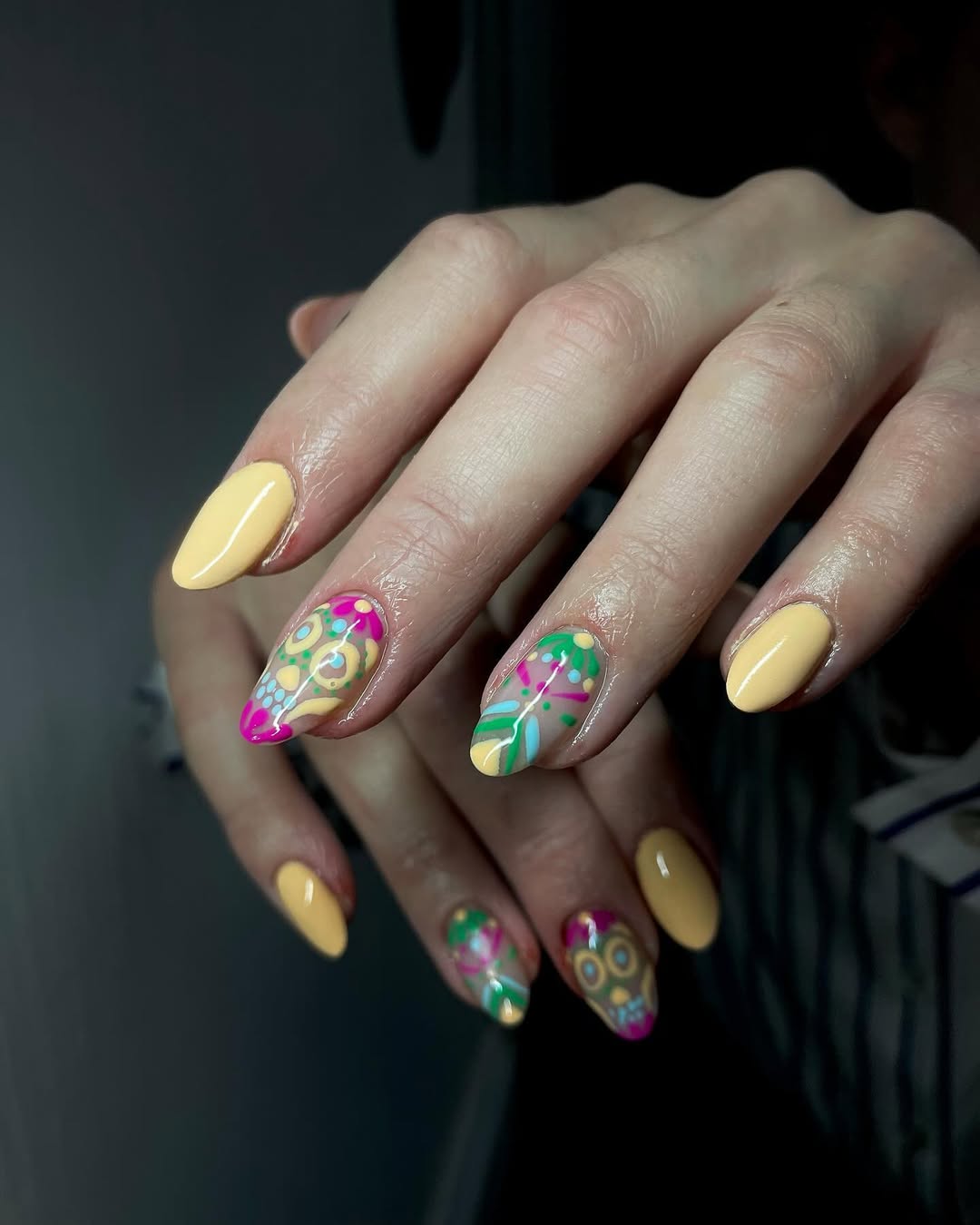 27 Stunning Mexican Nail Designs for 2026 22 Pale Yellow Nails With Colorful Day of the Dead Skulls