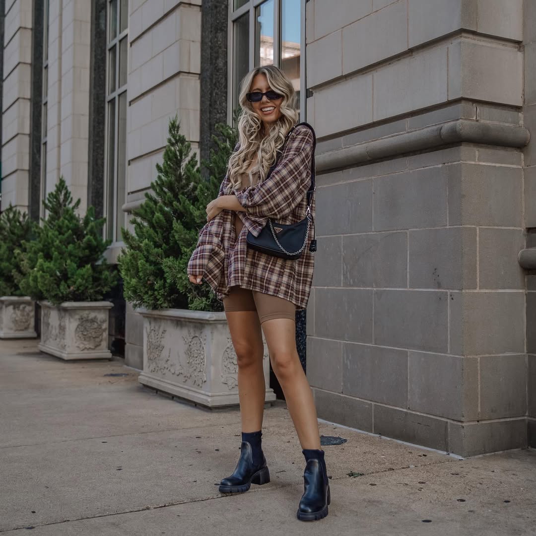 27 Fall Boot Outfit Ideas You Need Now 25 Plaid Oversized Shirt With Biker Shorts And Boots
