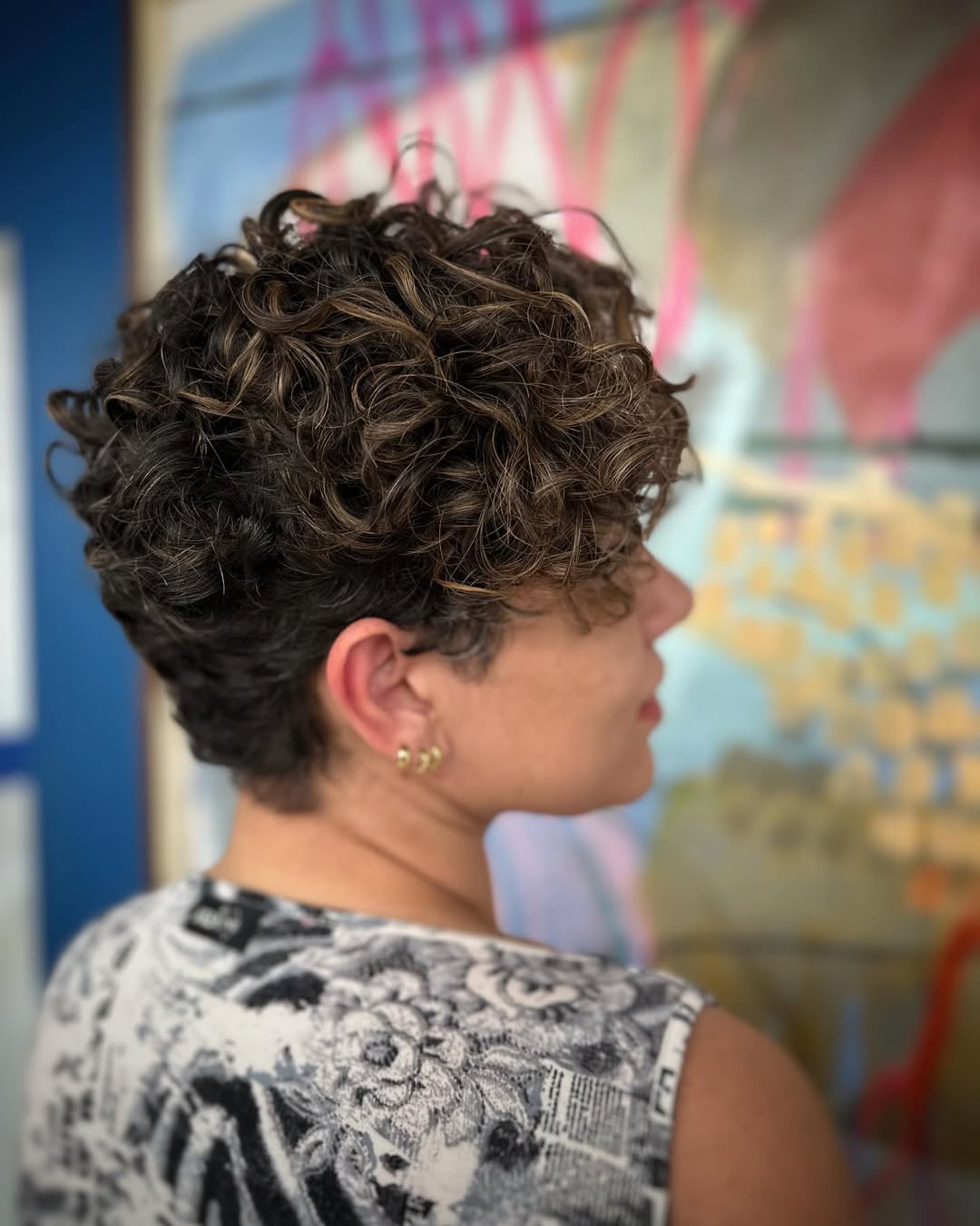 Playful Curly Pixie with Sun-Kissed Highlights