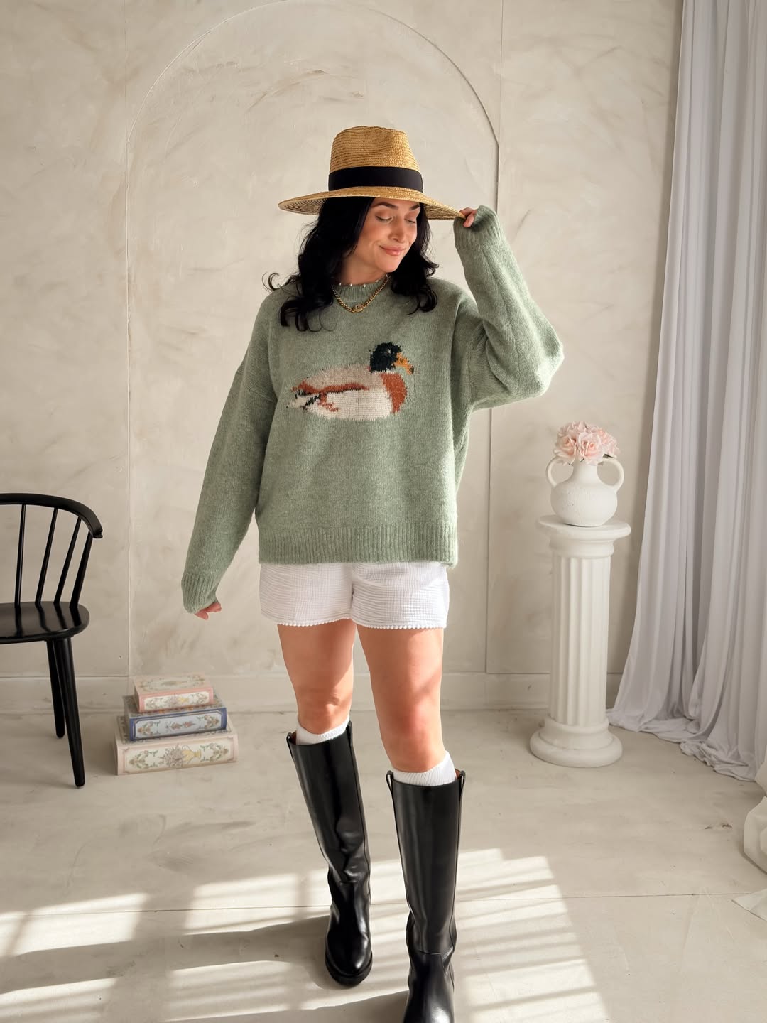 25 Early Fall Outfits You Need for 2026 27 Sage Duck Sweater With White Textured Shorts