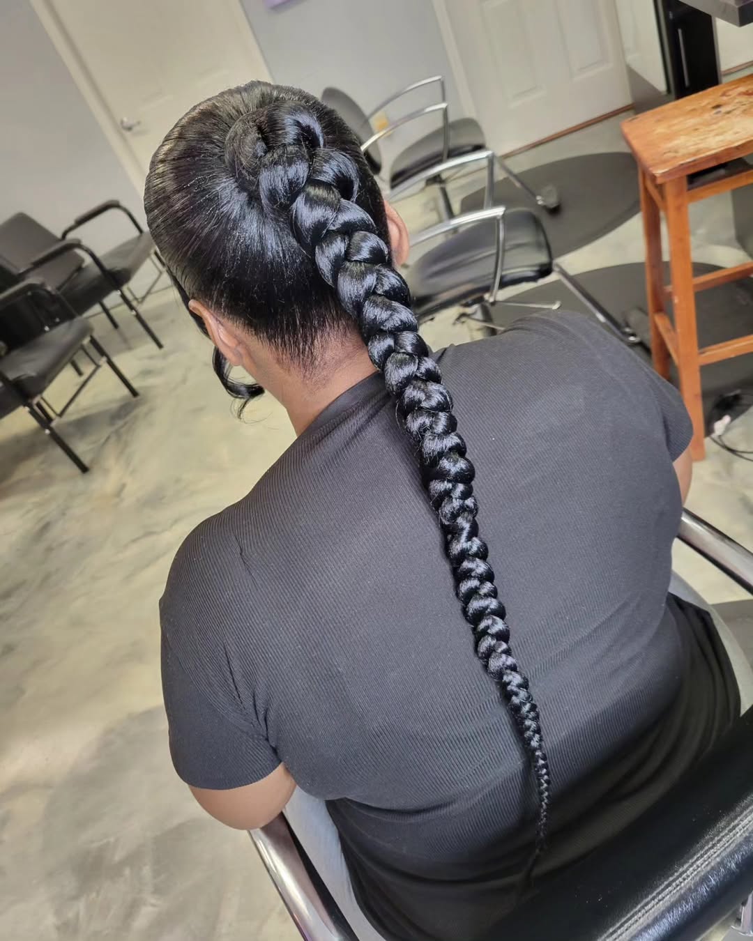 Sleek Braided Ponytail With Curled Baby Hairs