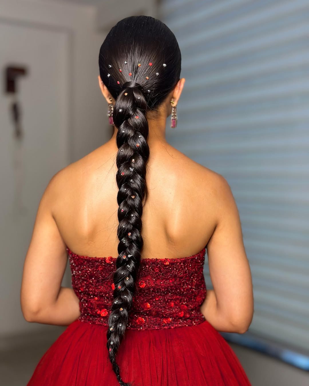 25 Sleek Hairstyles 2026 You Need To Try Now 12 Sleek Braided Ponytail With Rhinestone Embellishments