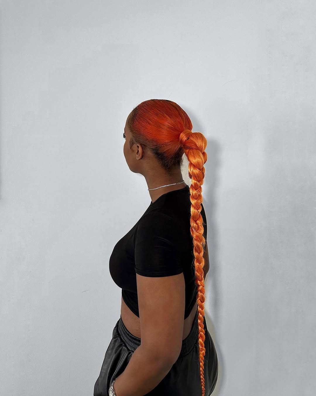 25 Sleek Hairstyles 2026 You Need To Try Now 21 Sleek Bubble Braid with Vibrant Orange Hair