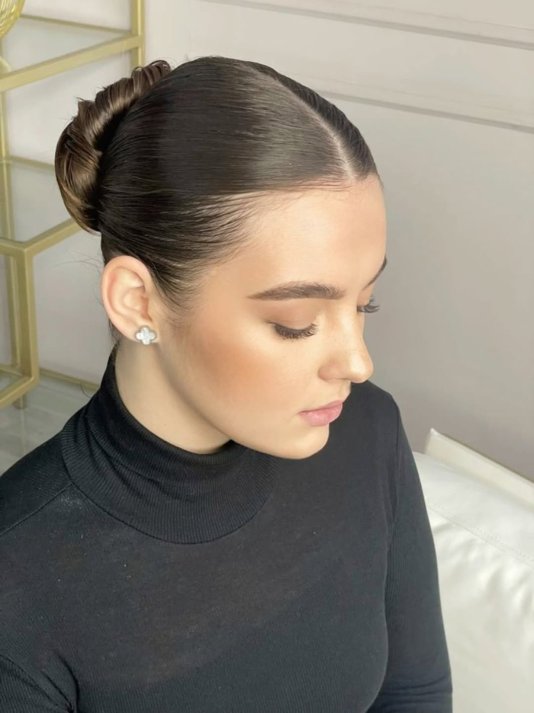 25 Sleek Hairstyles 2026 You Need To Try Now 26 Sleek Center Parted Low Bun